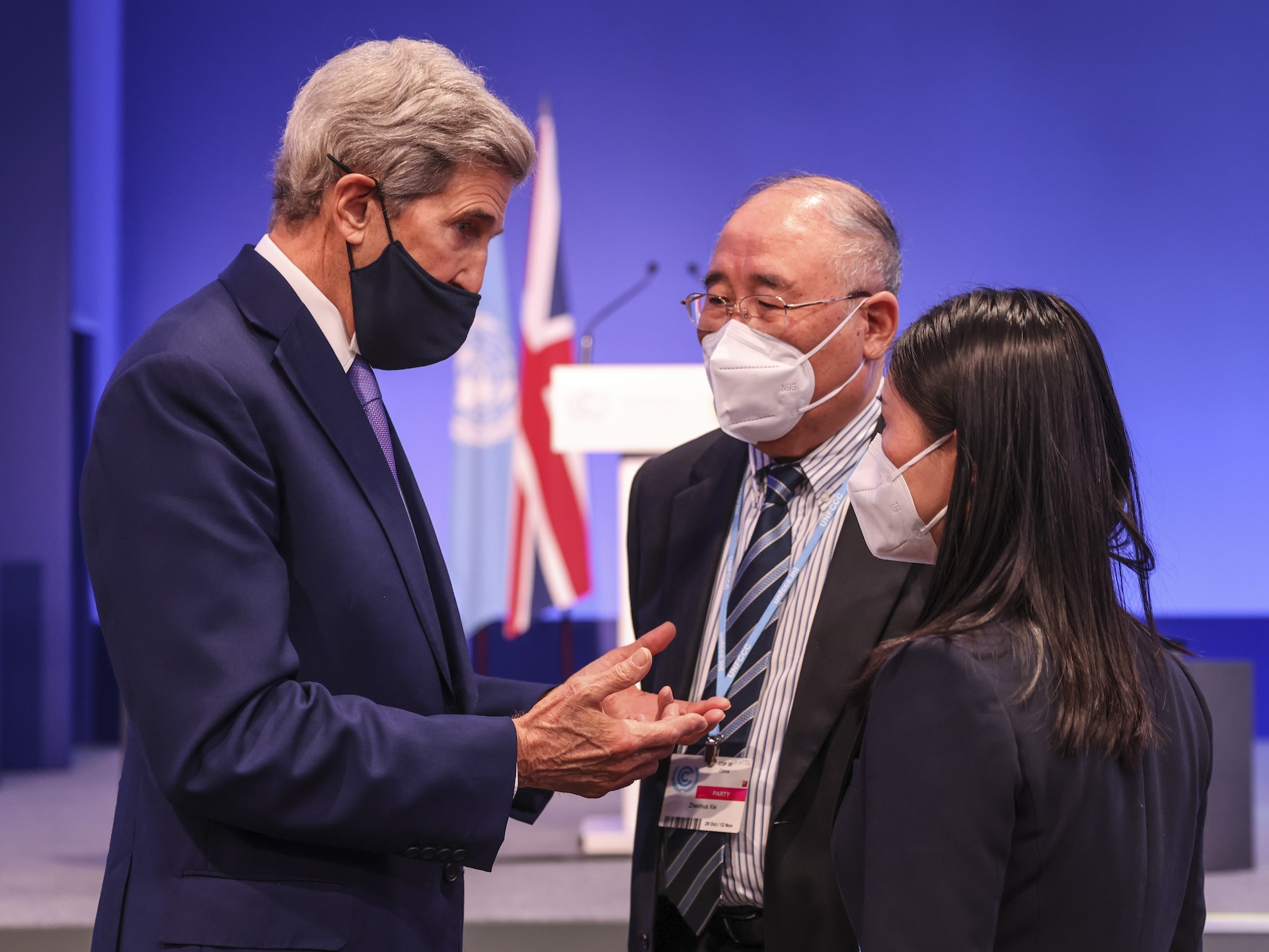 13/11/2021. Glasgow, United Kingdom. The U.S. Special Presidential Envoy for Climate, John Kerry talks to the Chinese special climate envoy Xie Zhenhua in an informal brush by at COP26. Picture by Tim Hammond / No 10 Downing Street